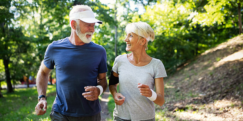 13583668 - hand pointing at a healthy living illustration on blue background.